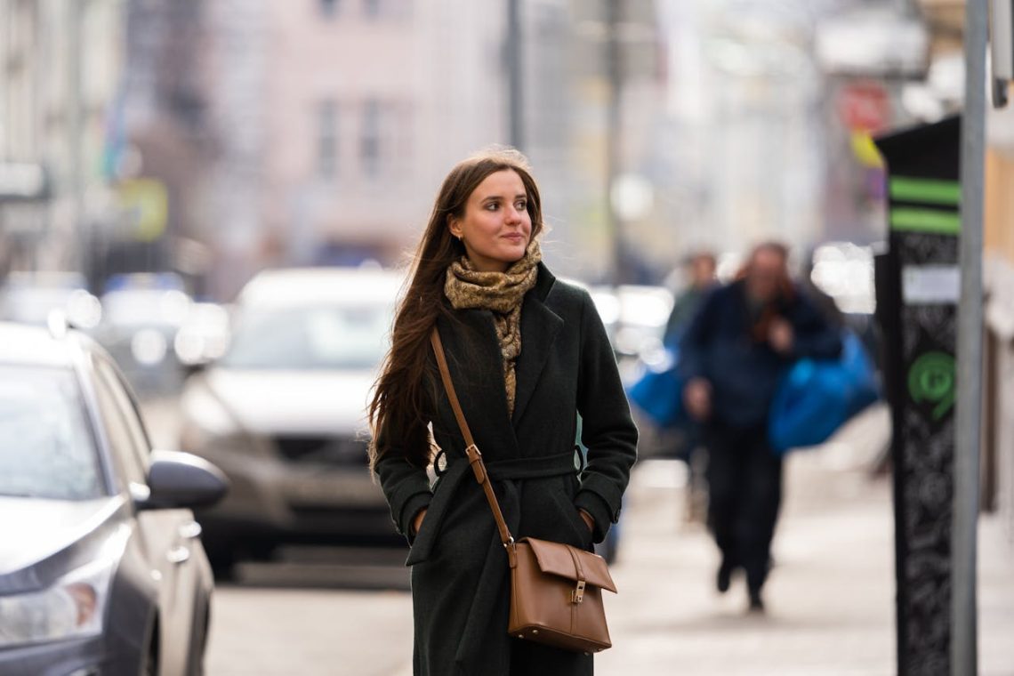 Woman wearing Brown leather sling bag
