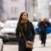 Woman wearing Brown leather sling bag